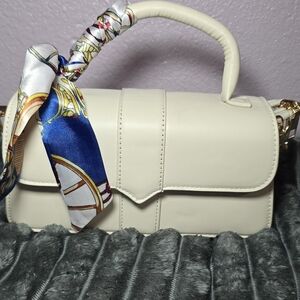 Elegant Cream Handbag with Scarf Accent